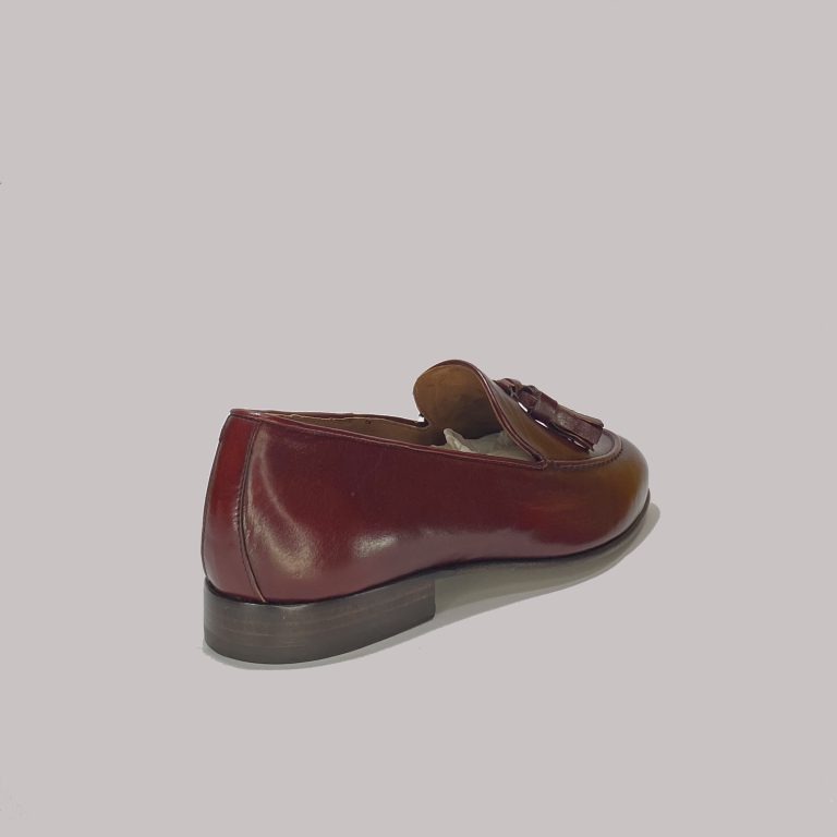 Red Cartier leather loafers for exclusive B2B collections.